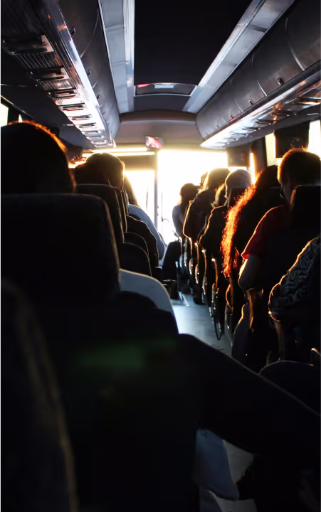 A group of people on a bus ride